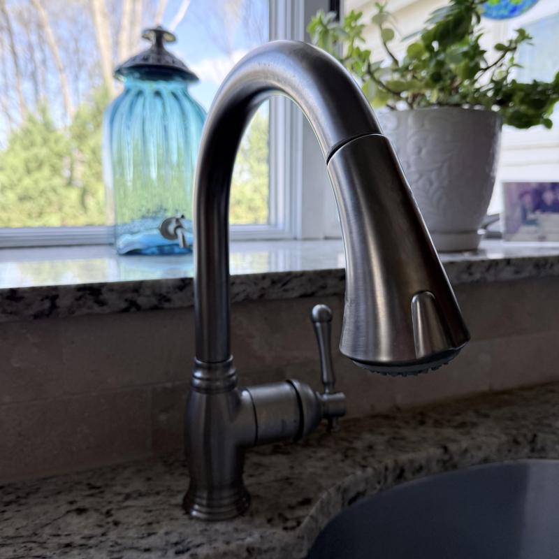 Kohler kitchen faucet installed on granite countertop