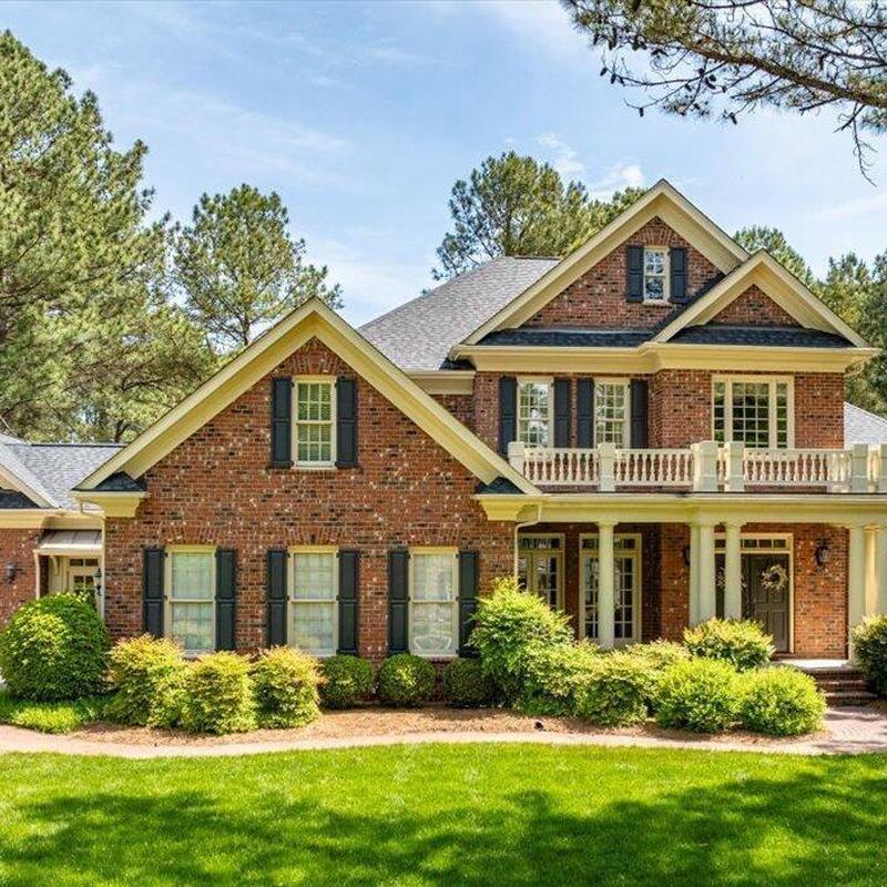 Brick house exterior with landscaping and porch