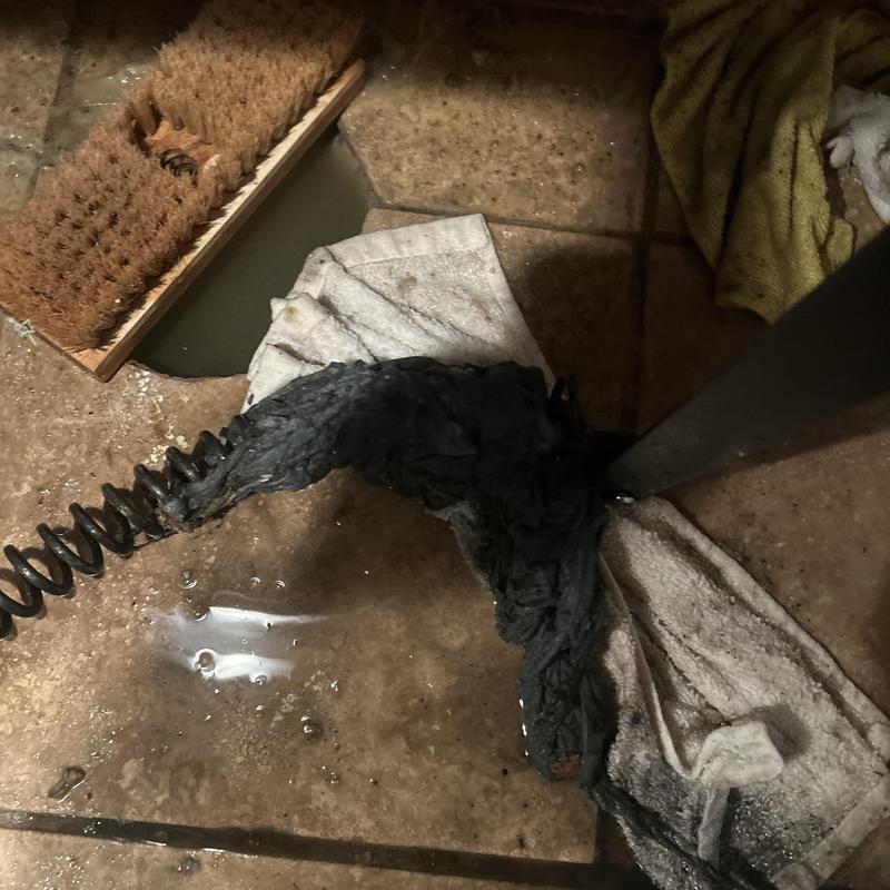 Main sewer line clog with debris removal tools