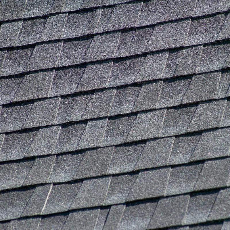 Roof shingles replacement close-up on residential roof