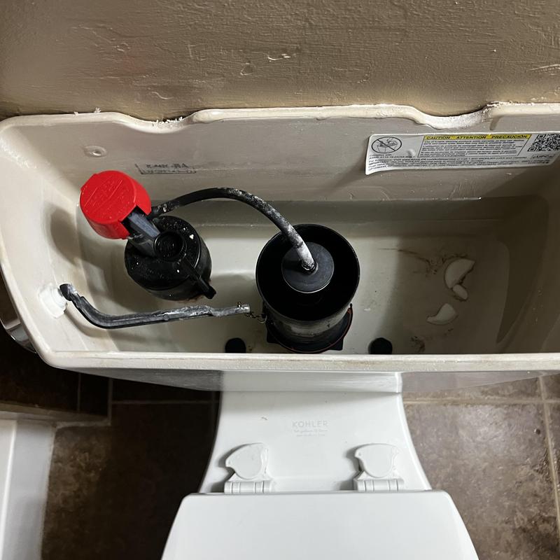Toilet tank interior with flush valve and fill valve components