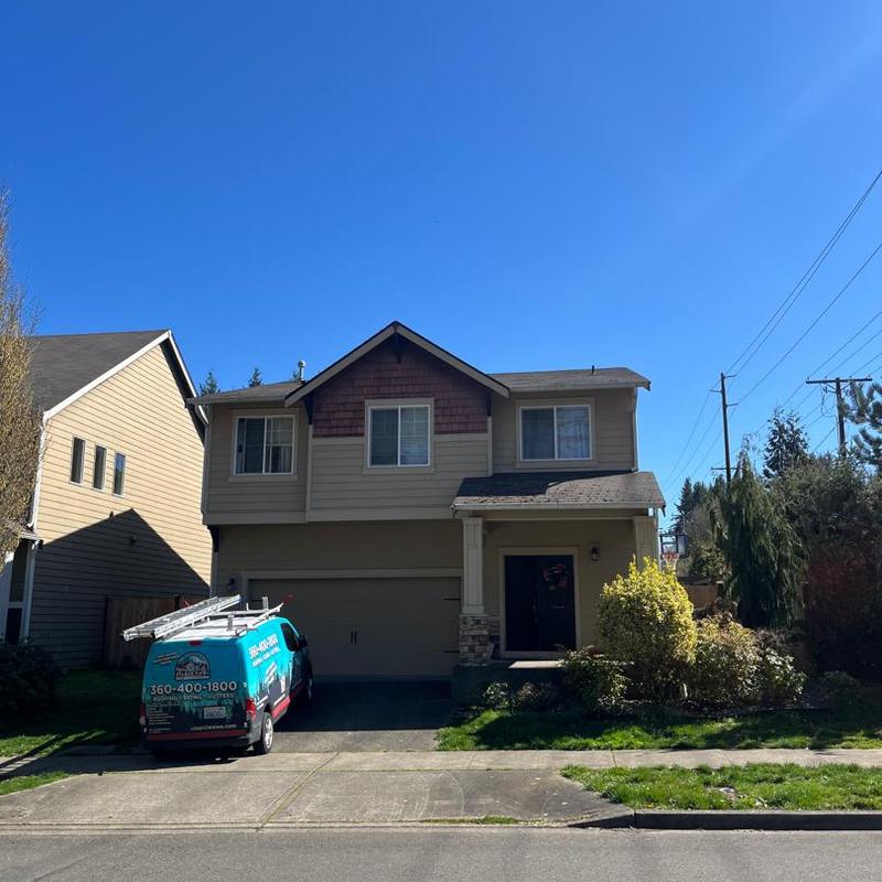 Asphalt shingle roof cleaning on residential house