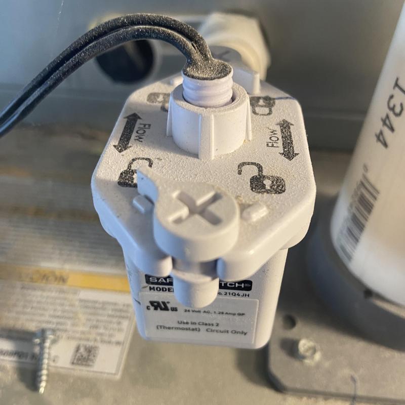 Ignition safety switch on HVAC unit during inspection