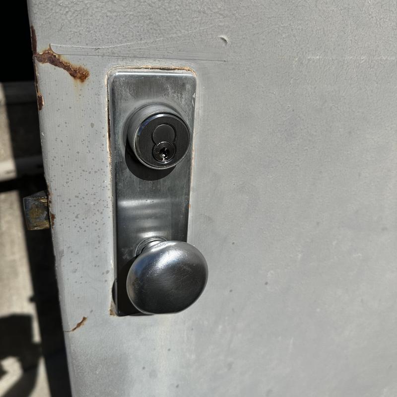 Interchangeable core cylinder lock on metal door