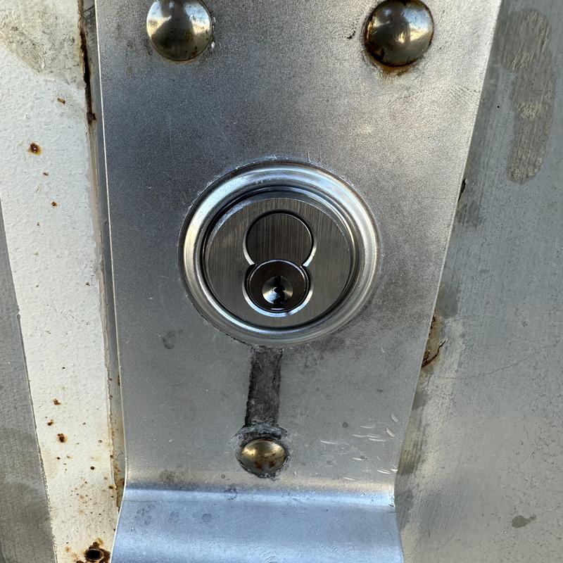 Interchangeable core cylinder lock on metal door