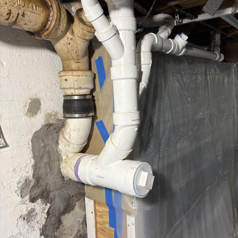PVC plumbing stack rerouted from dry well to septic system