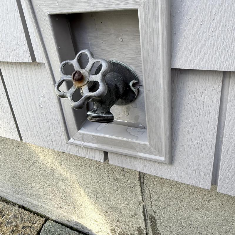 Globe valve with old hose connection leaking outdoors