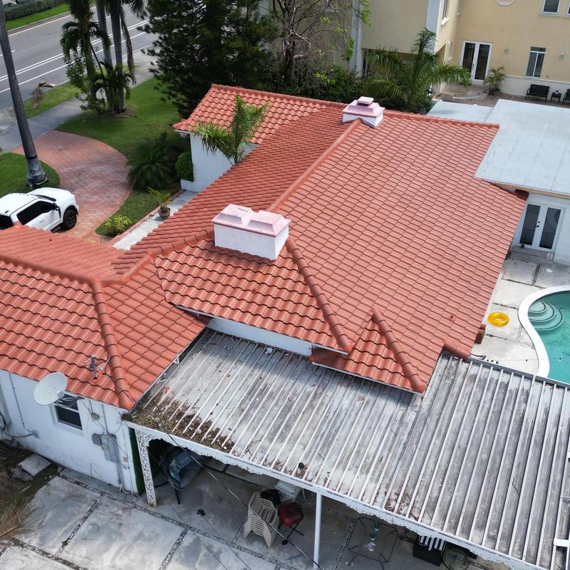 Clay tile roof with chimneys in residential area