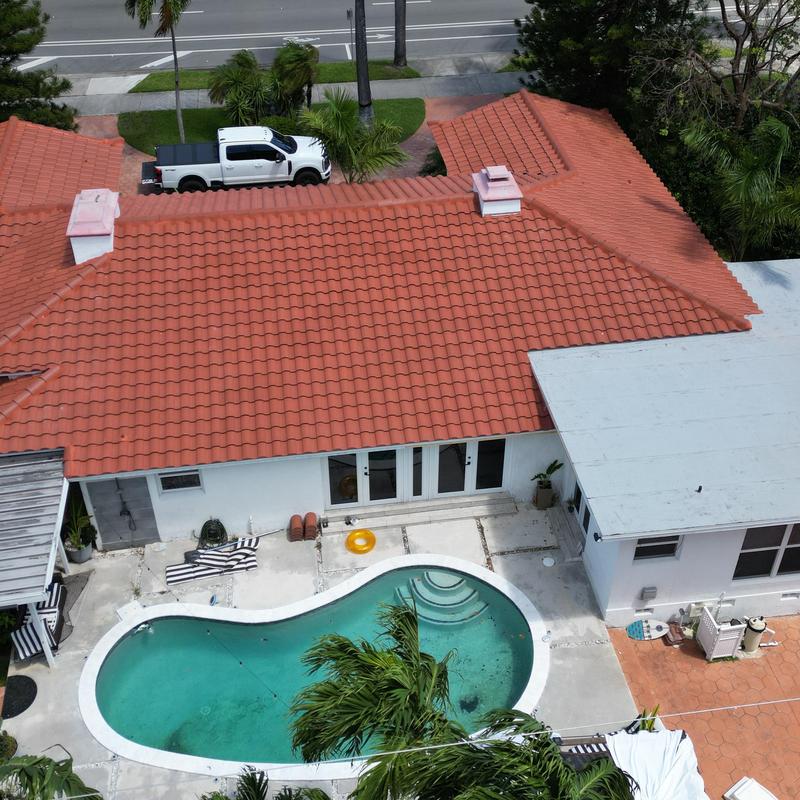 Spanish tile roof with pool and backyard patio