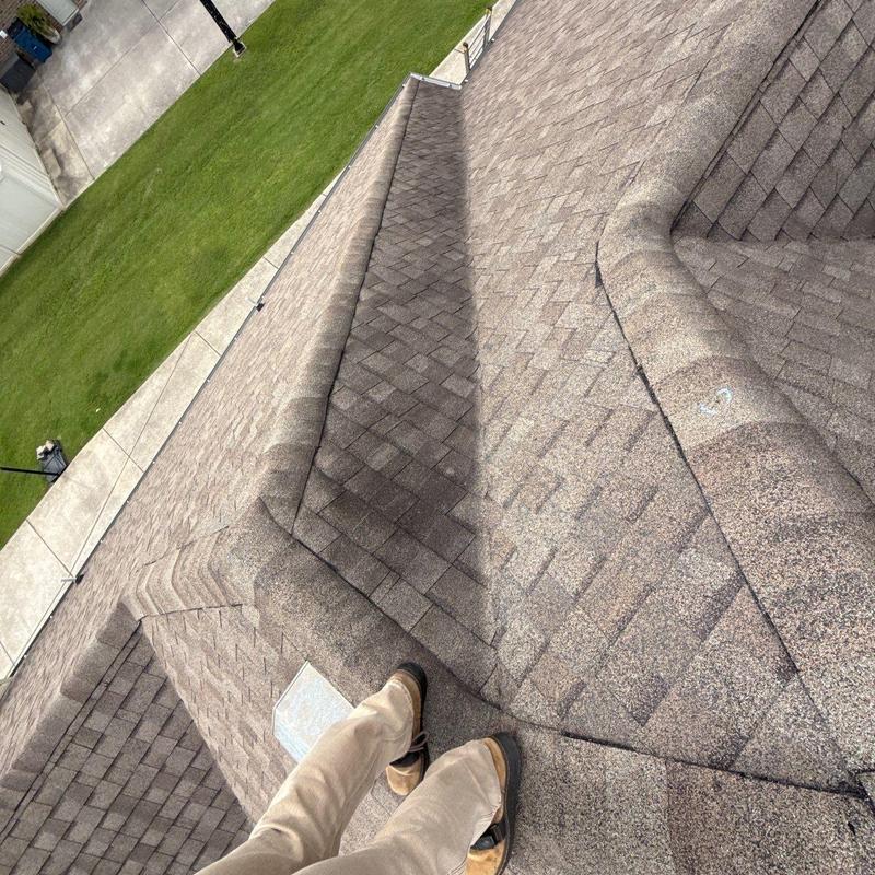 Asphalt shingle roof with hail damage and granule loss