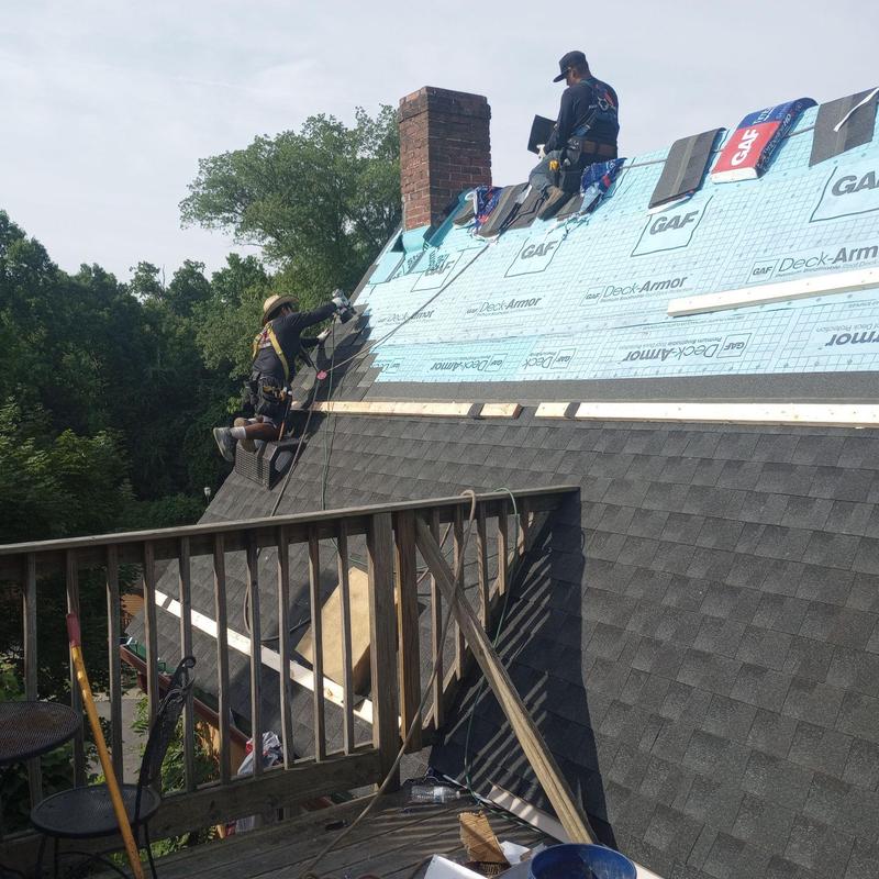 Roof underlayment and shingle installation on steep roof Roof underlayment and shingle installation on steep roof