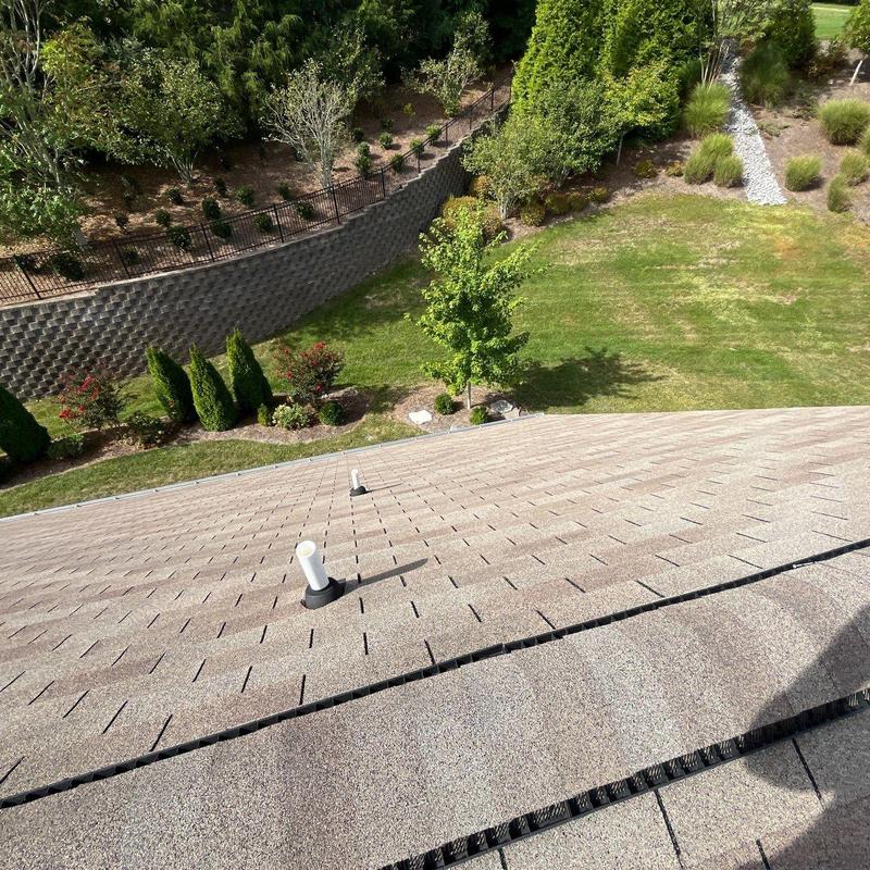 Roof shingles and vent pipe on residential roof