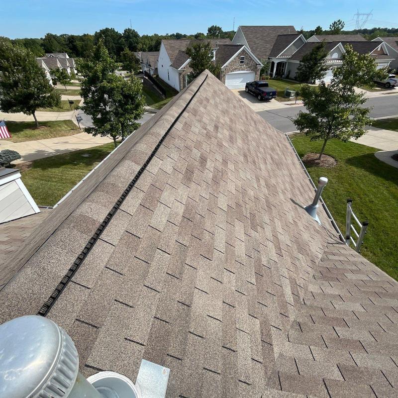Asphalt shingle roof with ridge vent installation