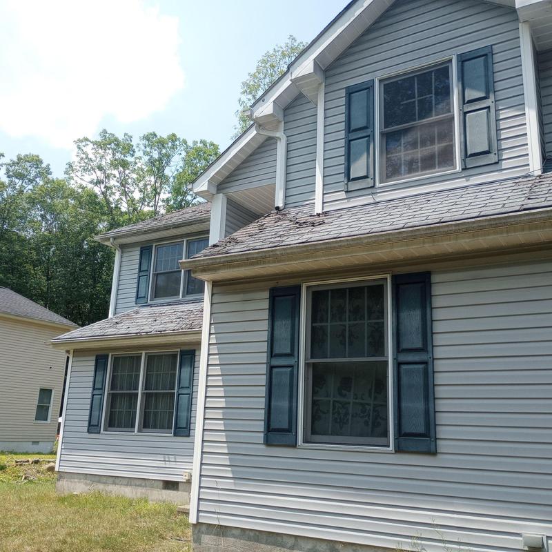 Worn asphalt shingles on residential roof in East Stroudsburg Worn asphalt shingles on residential roof in East Stroudsburg