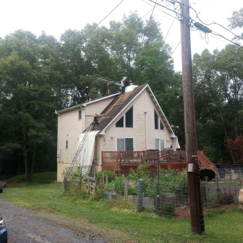 Roof shingles removal and replacement on two-story house Roof shingles removal and replacement on two-story house