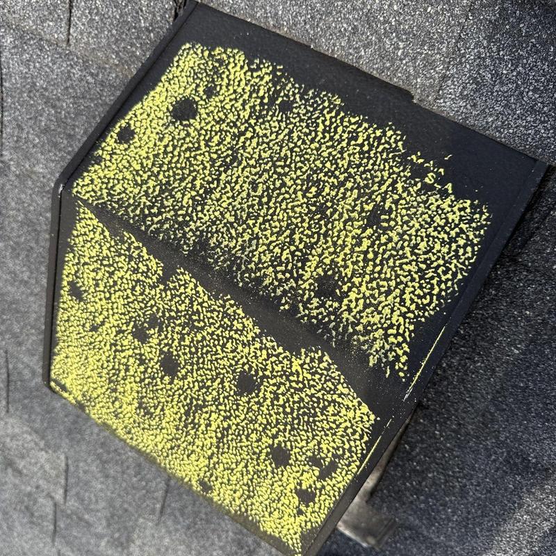Roof shingle hail damage marked with yellow chalk