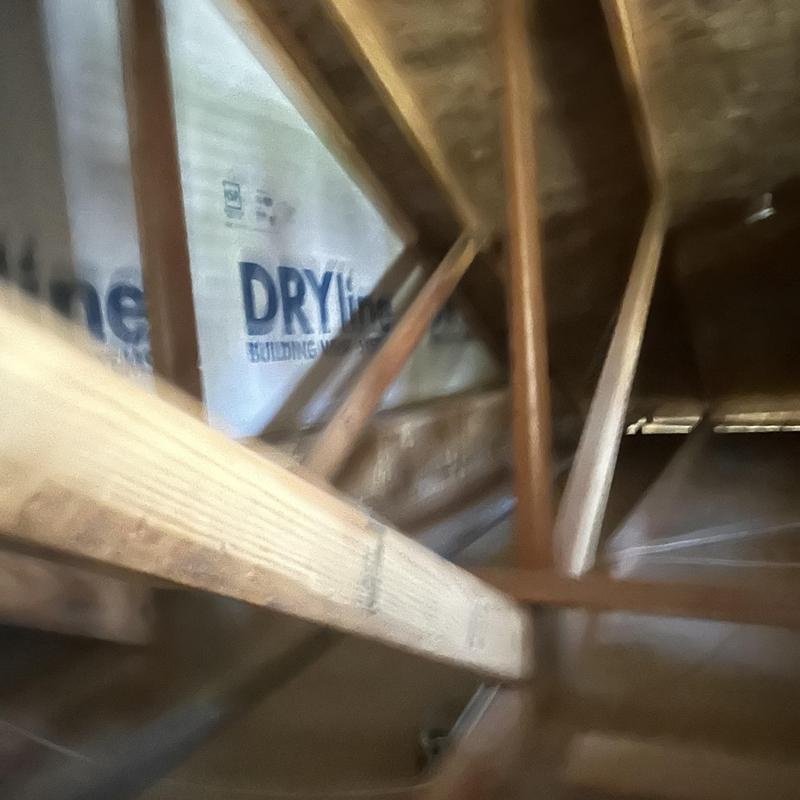 Attic wooden framing and insulation installation detail