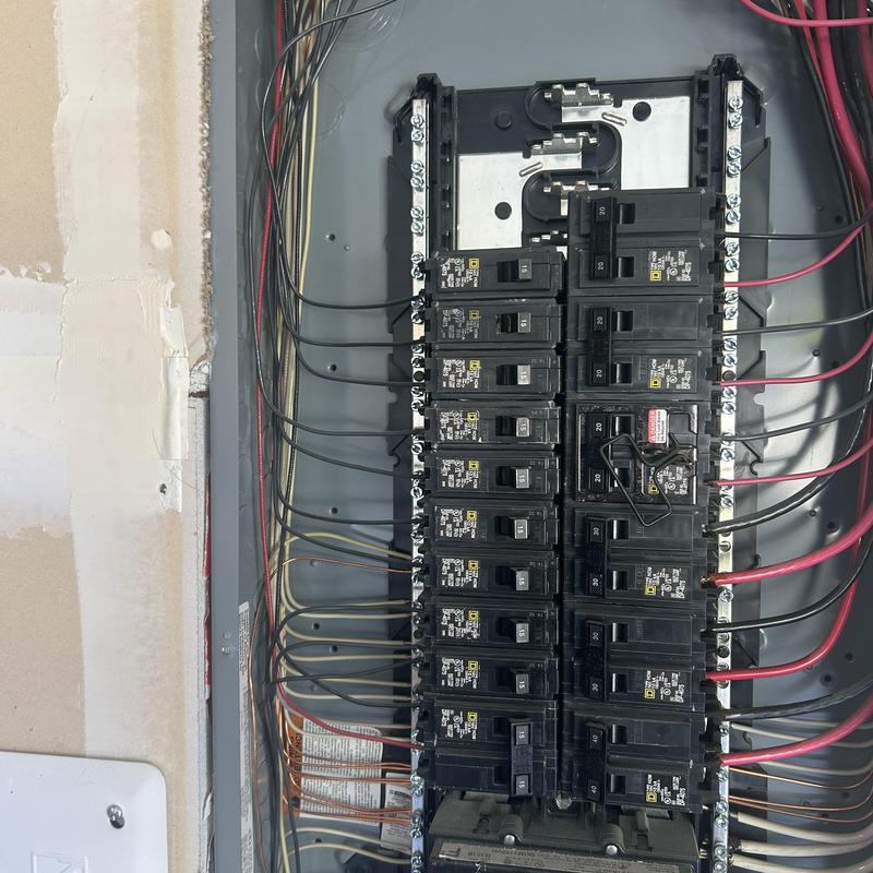 Electrical circuit breaker panel with wiring in wall