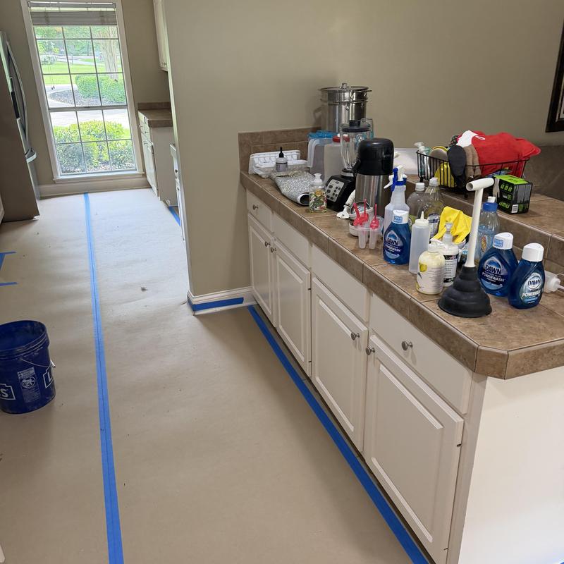 Kitchen countertops and cabinets prepped for demo