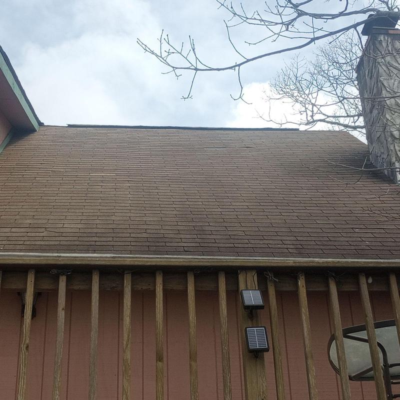 Asphalt shingle roof with gutter and chimney view Asphalt shingle roof with gutter and chimney view