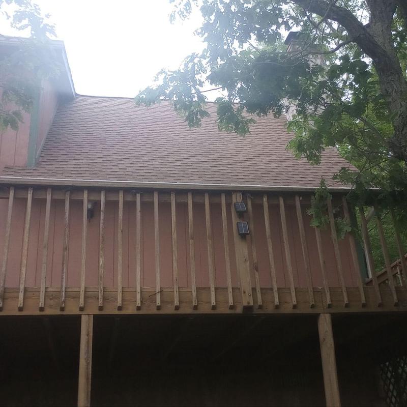 Asphalt shingle roof replacement with wooden deck railing Asphalt shingle roof replacement with wooden deck railing