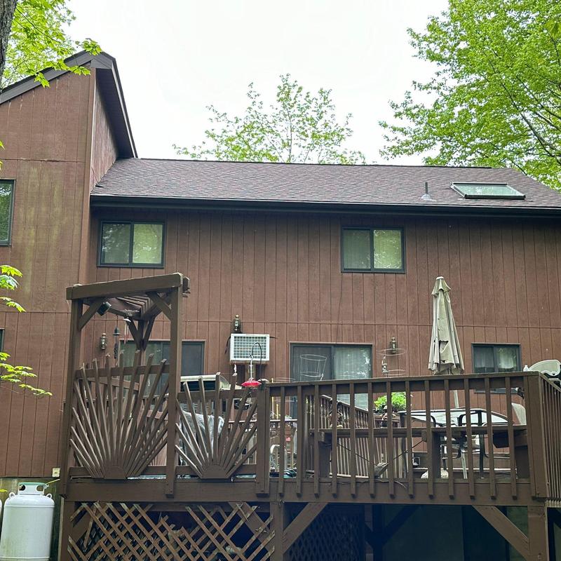 Roof shingles on residential home with skylight Roof shingles on residential home with skylight