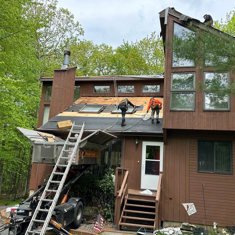 Roof shingles installation on residential home roof Roof shingles installation on residential home roof