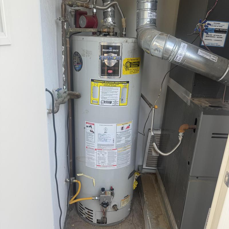 Bradford White gas tank water heater in utility closet Bradford White gas tank water heater in utility closet