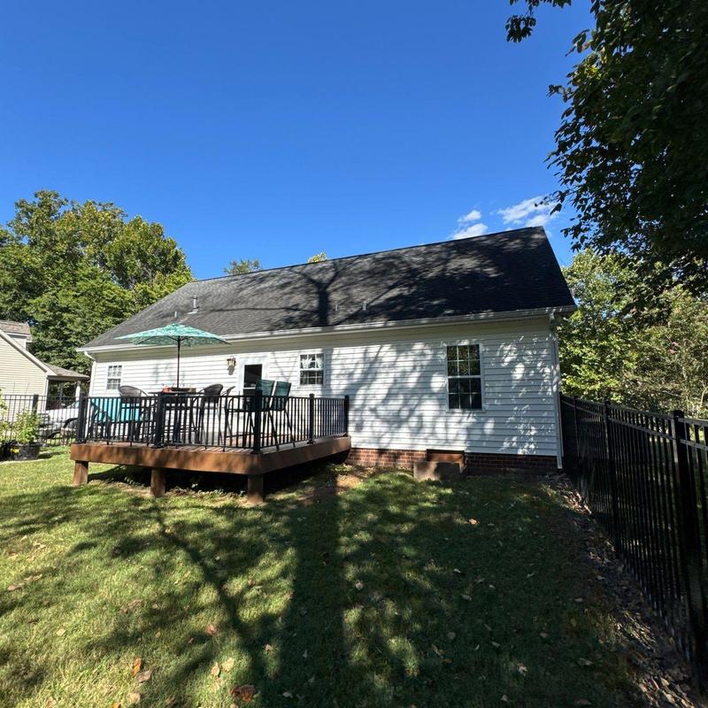 Residential roof with hail damage and shaded deck area