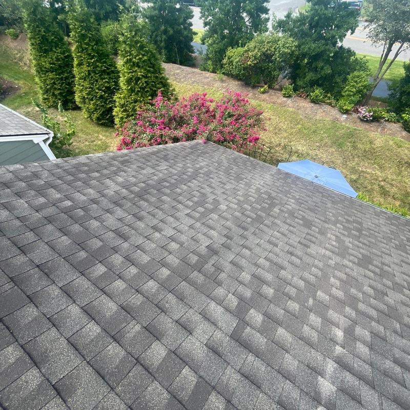 Asphalt shingle roof with hail damage inspection