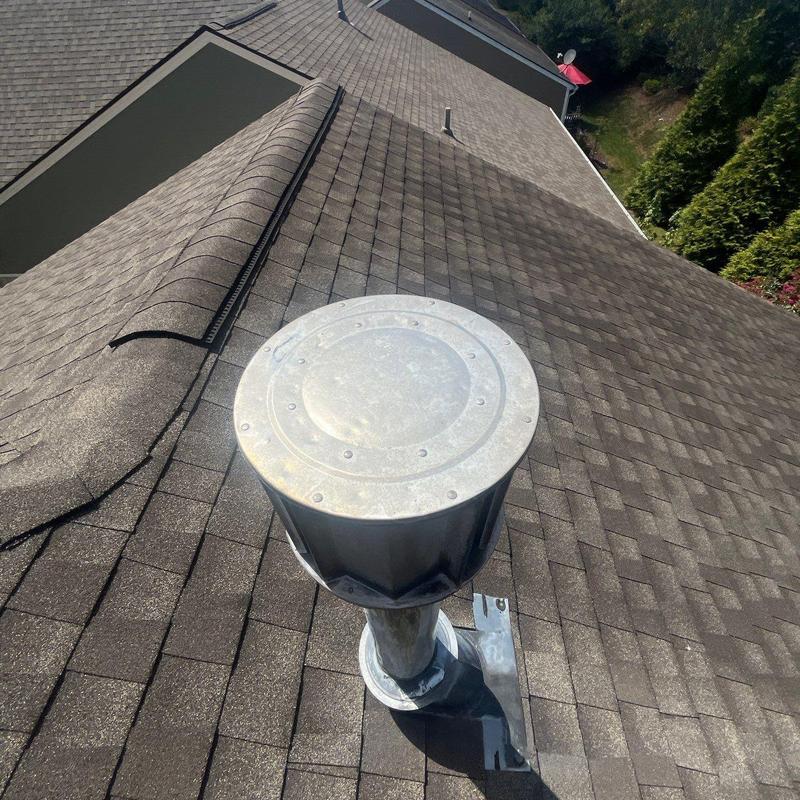 Roof vent pipe flashing on asphalt shingle roof
