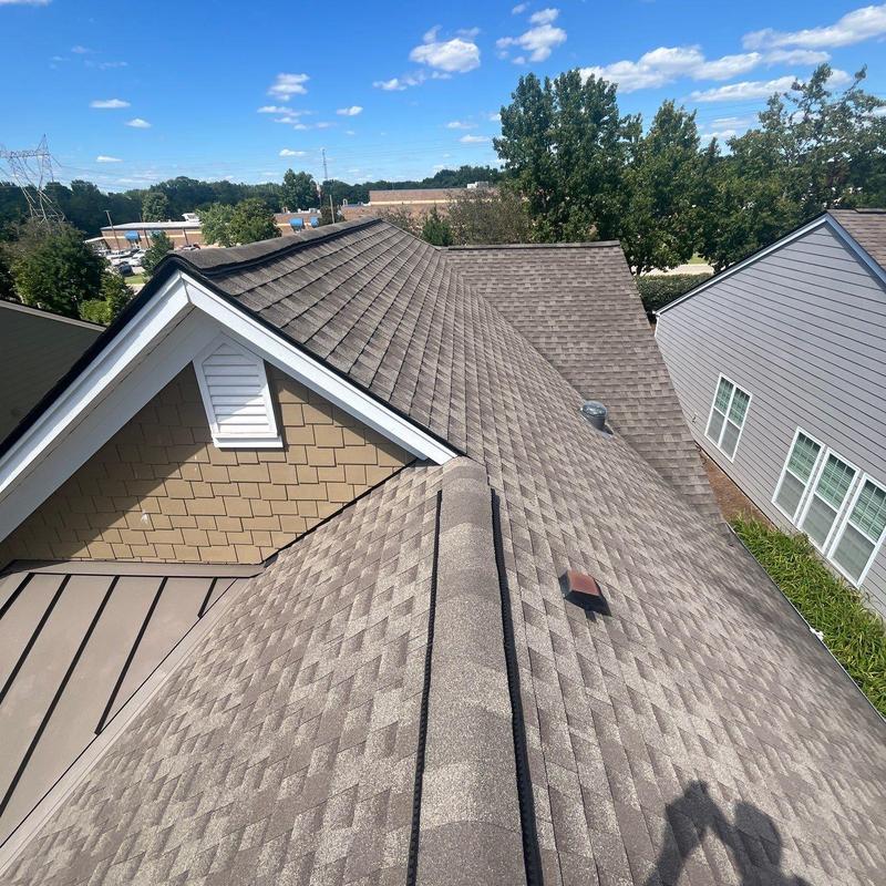 Roof shingles with hail damage on residential home