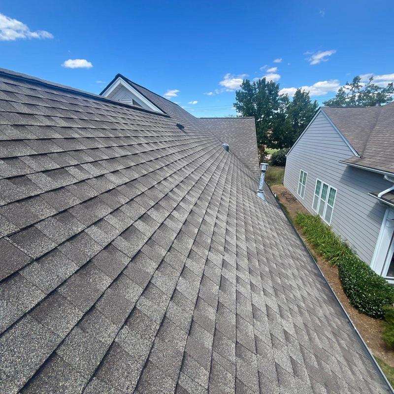 Asphalt shingle roof with hail damage inspection