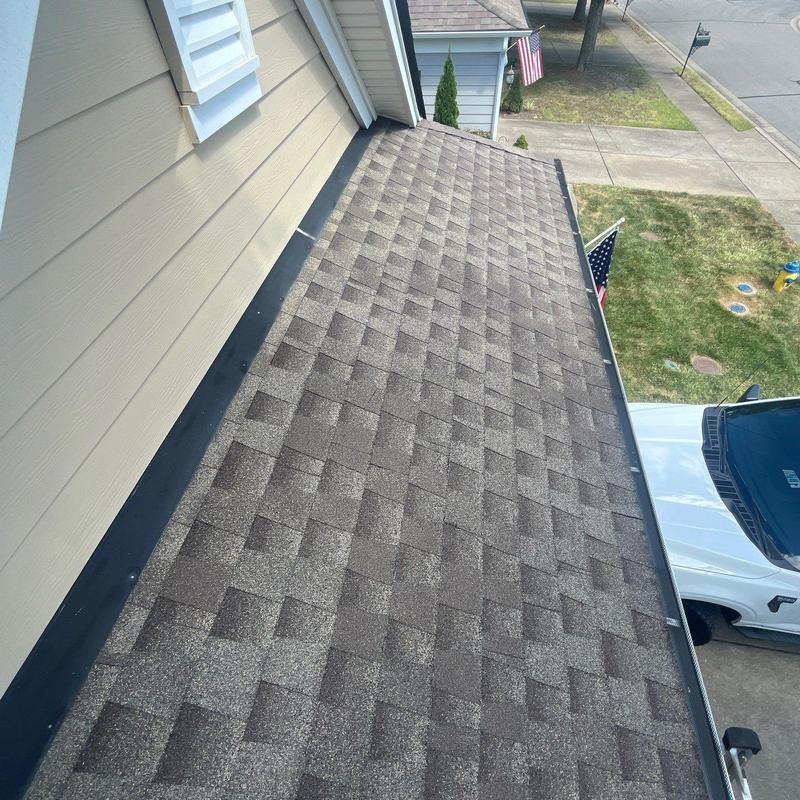Asphalt shingle roof with hail damage inspection
