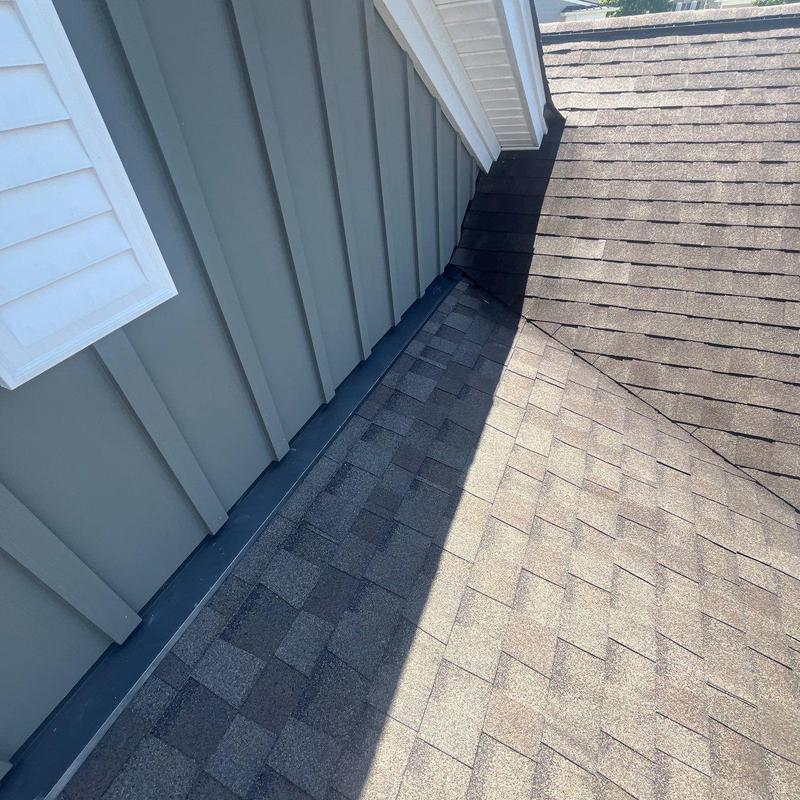 Asphalt shingle roof and metal flashing with minor damage
