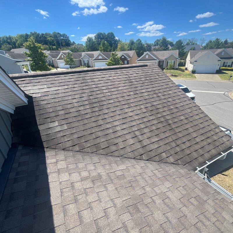 Asphalt shingle roof with hail damage inspection