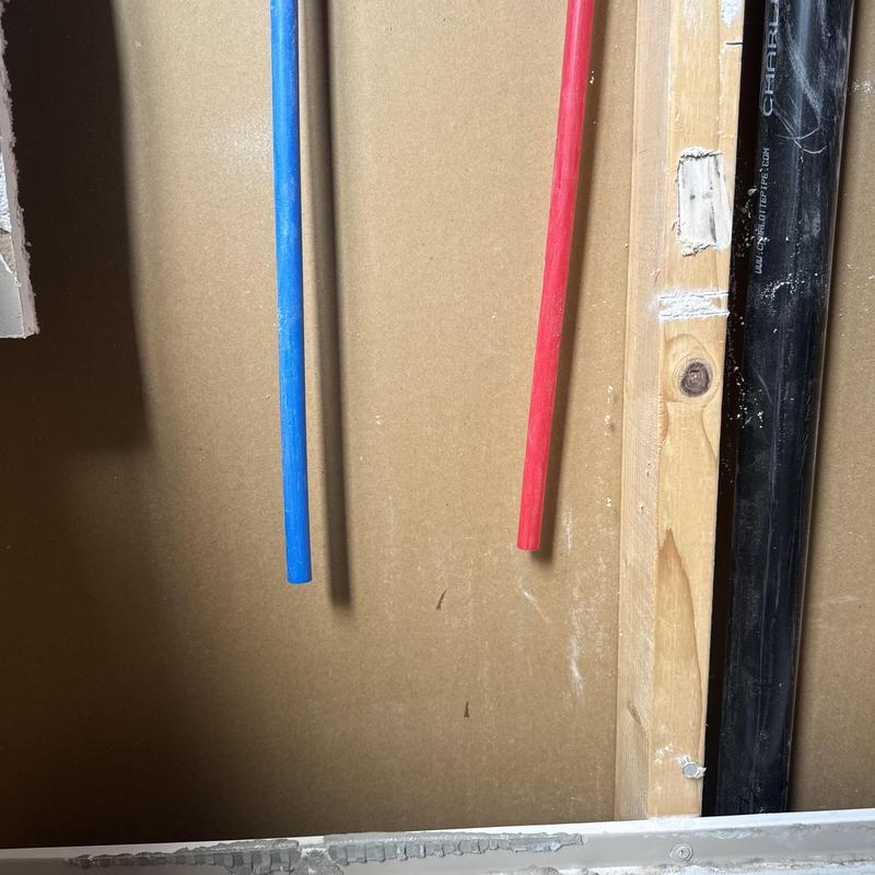 Tub water supply pipes blue and red lines installed