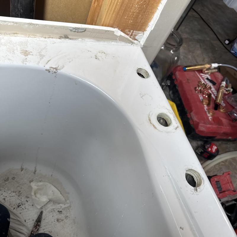 Tub faucet mounting holes on bathtub edge