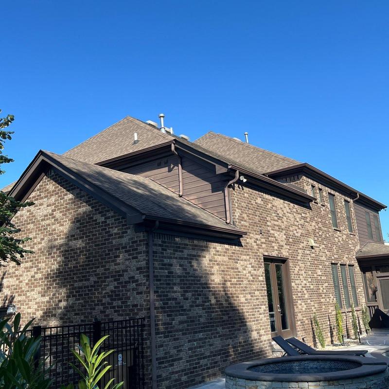 Asphalt shingle roof and flashing with hail damage