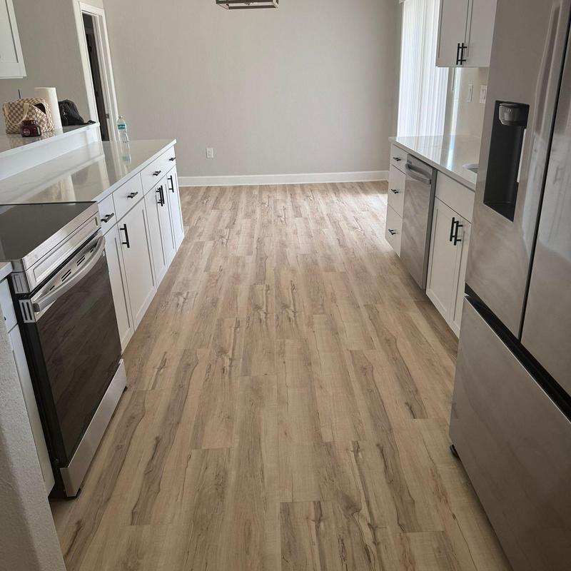 Wood-look vinyl kitchen flooring installation in Punta Gorda