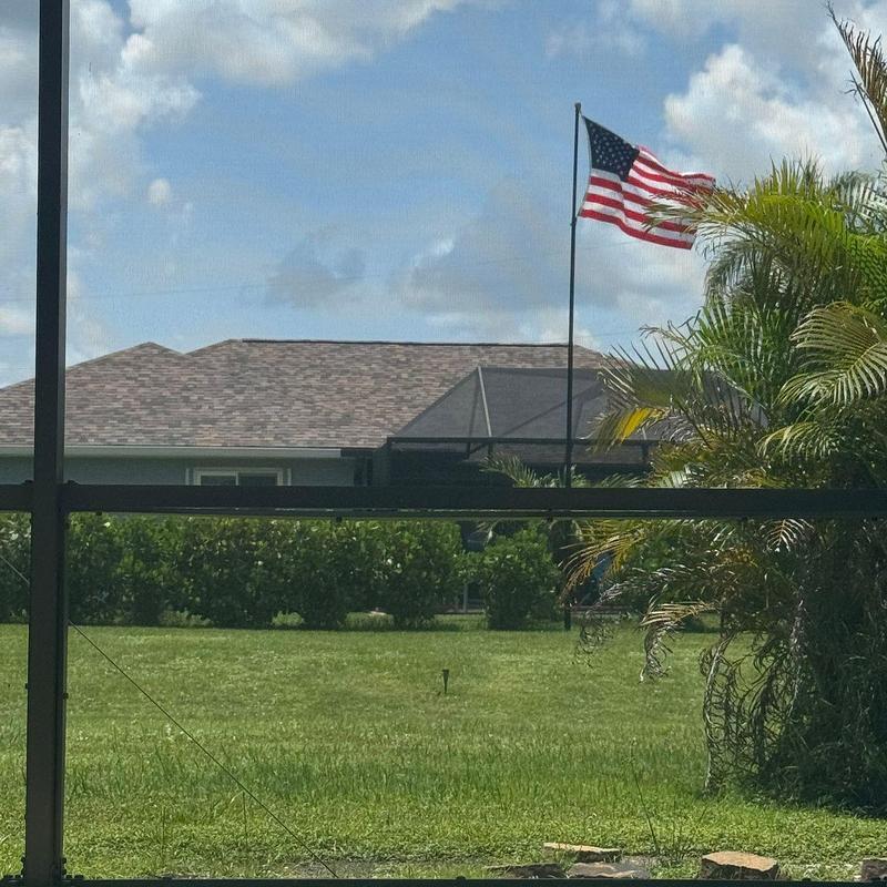 Pool lanai screen enclosure with landscaping in Punta Gorda
