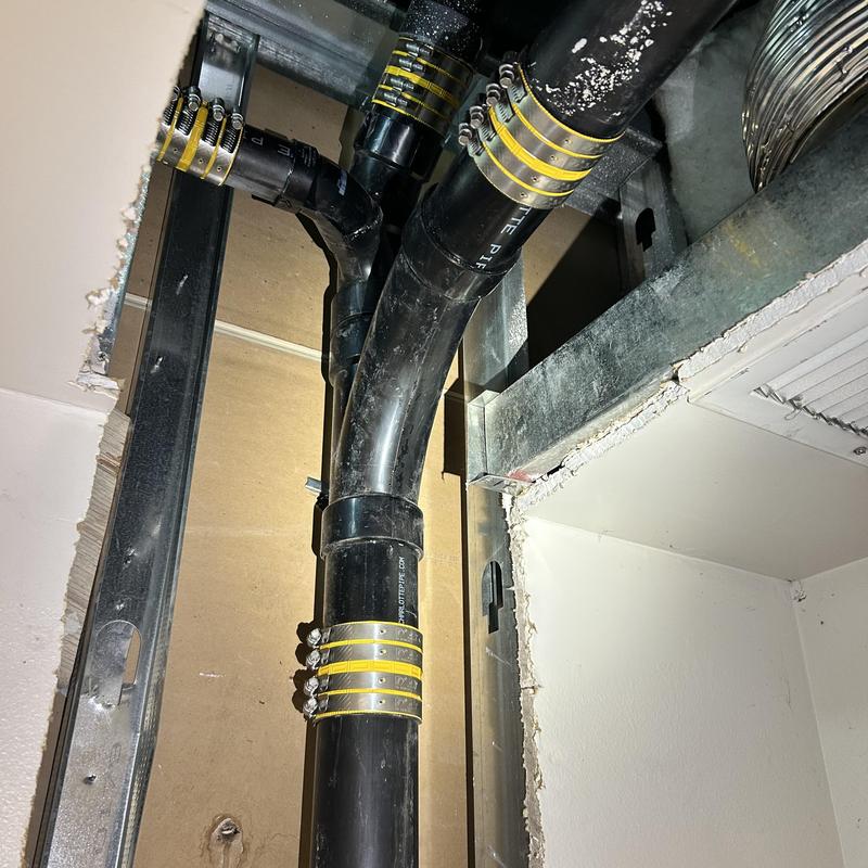 Drain line piping with new couplings and fittings installed