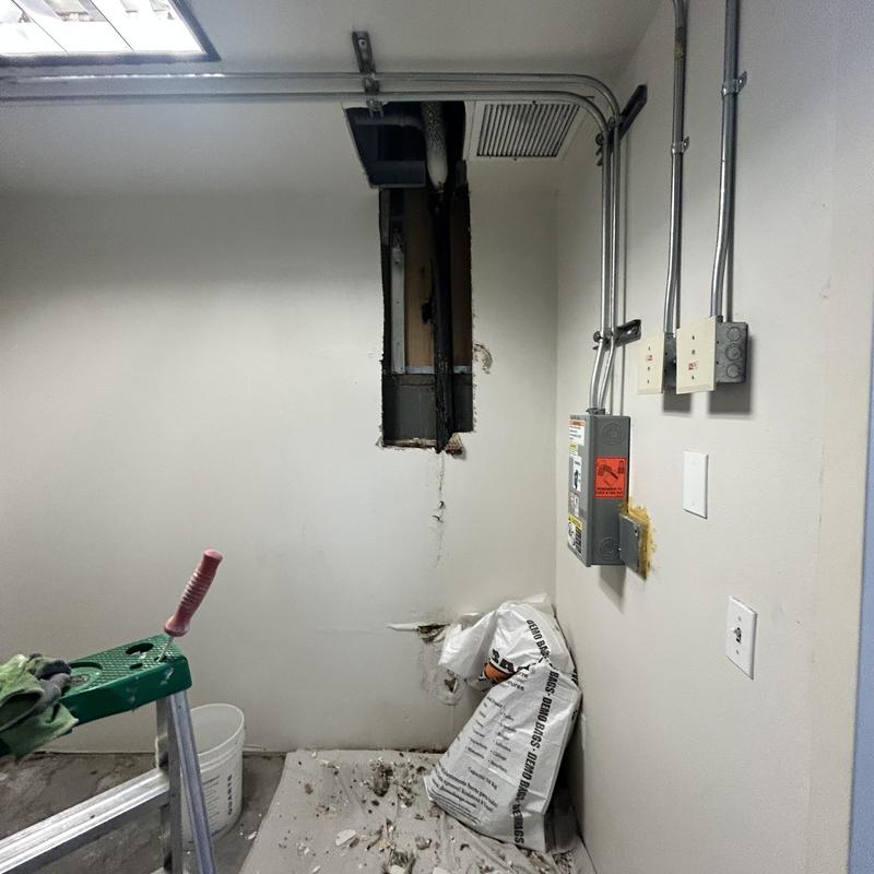 Drain line leak with drywall removal in commercial building