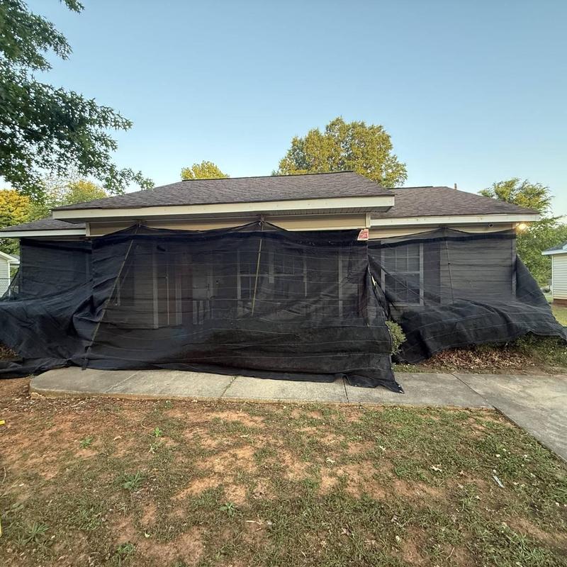 Roof with black mesh wind and hail damage protection Roof with black mesh wind and hail damage protection