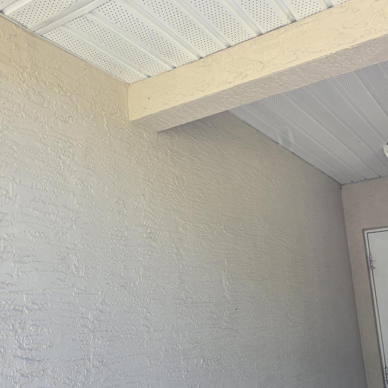 Stucco wall exterior cleaning with soft wash system Stucco wall exterior cleaning with soft wash system