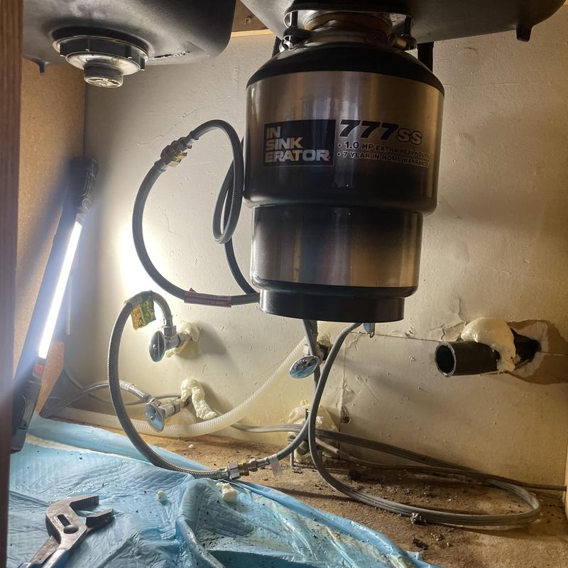 Garbage disposal unit and kitchen sink drain plumbing setup