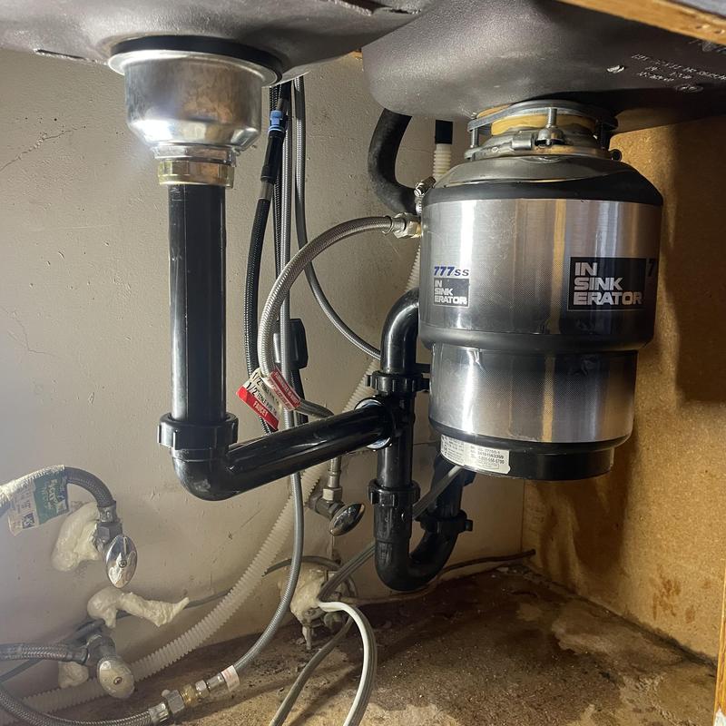 Kitchen sink garbage disposal and drain pipes installation