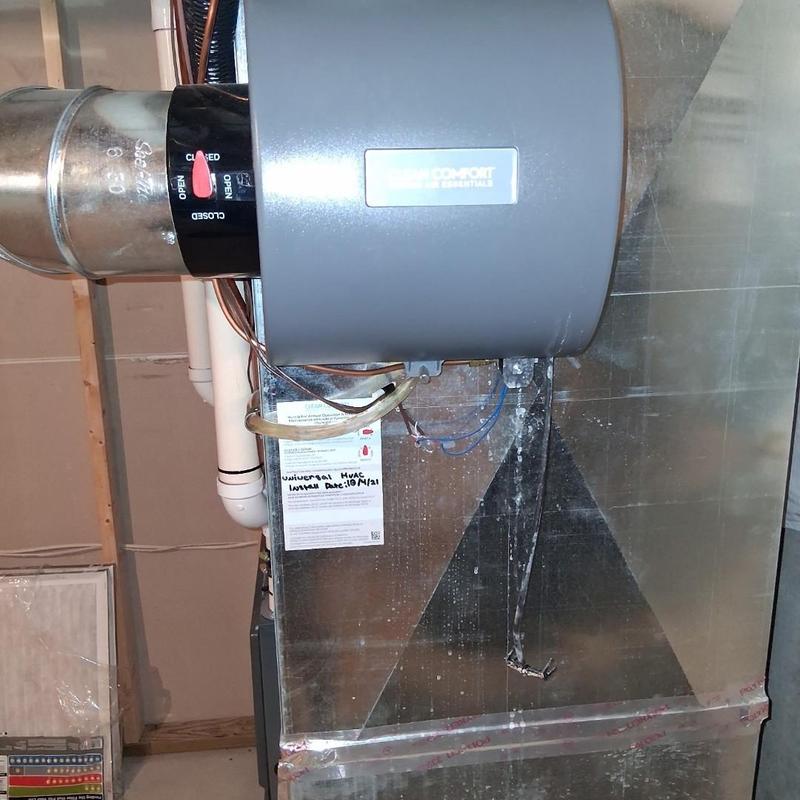 Humidifier unit with replaced pad on HVAC system
