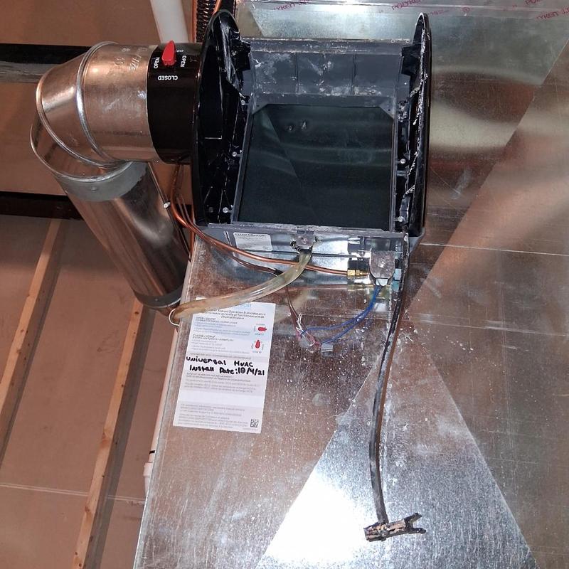 Humidifier pad housing with duct and wiring exposed