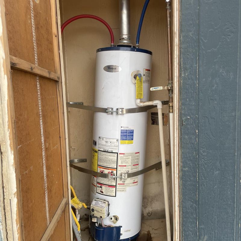 Water heater installation with new gas valve and venting